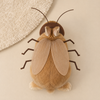 Rabbit wearing a plush cockroach costume with wings.