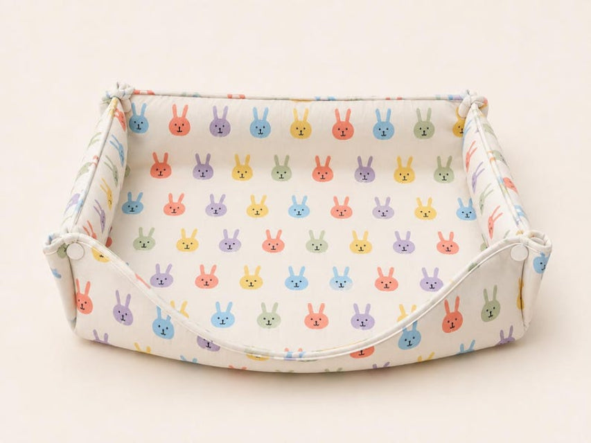Foldable fabric rabbit hay box in the Colorful Rabbit print.